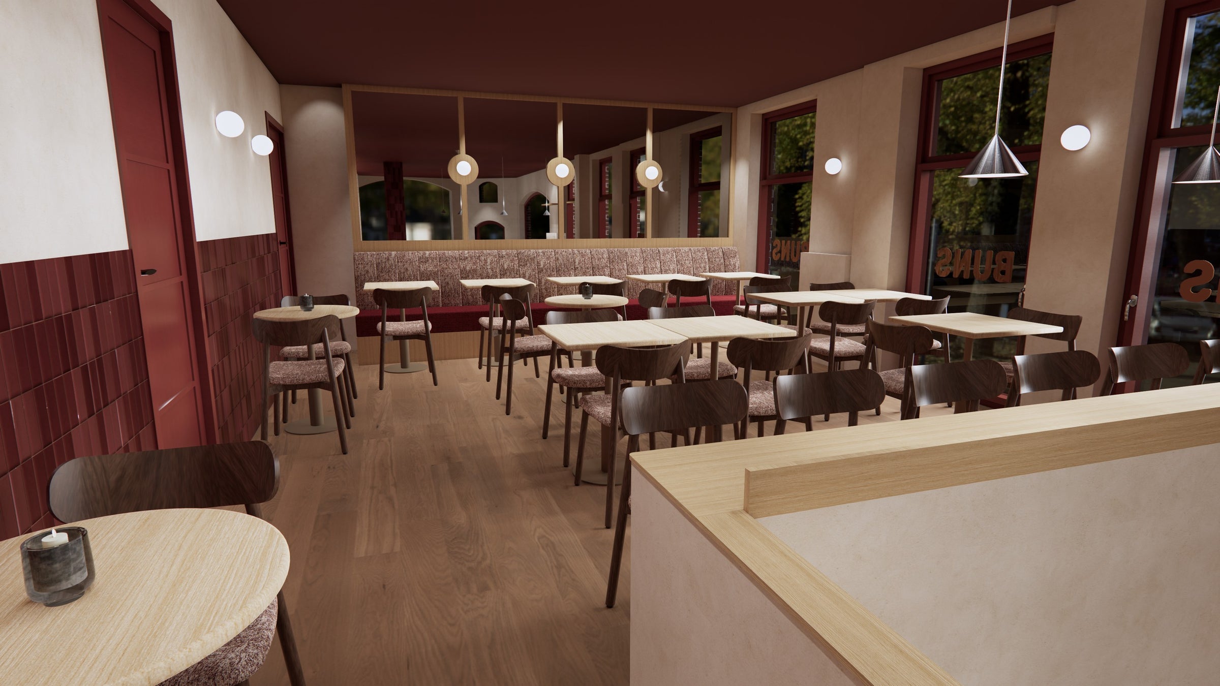 BUNS Amsterdam - restaurantzaal met banken en houten vloer